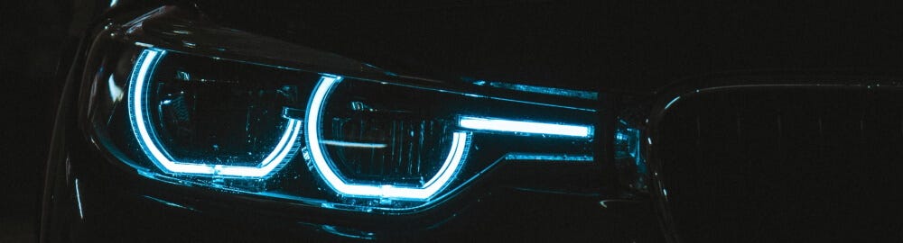 lit headlight in the dark